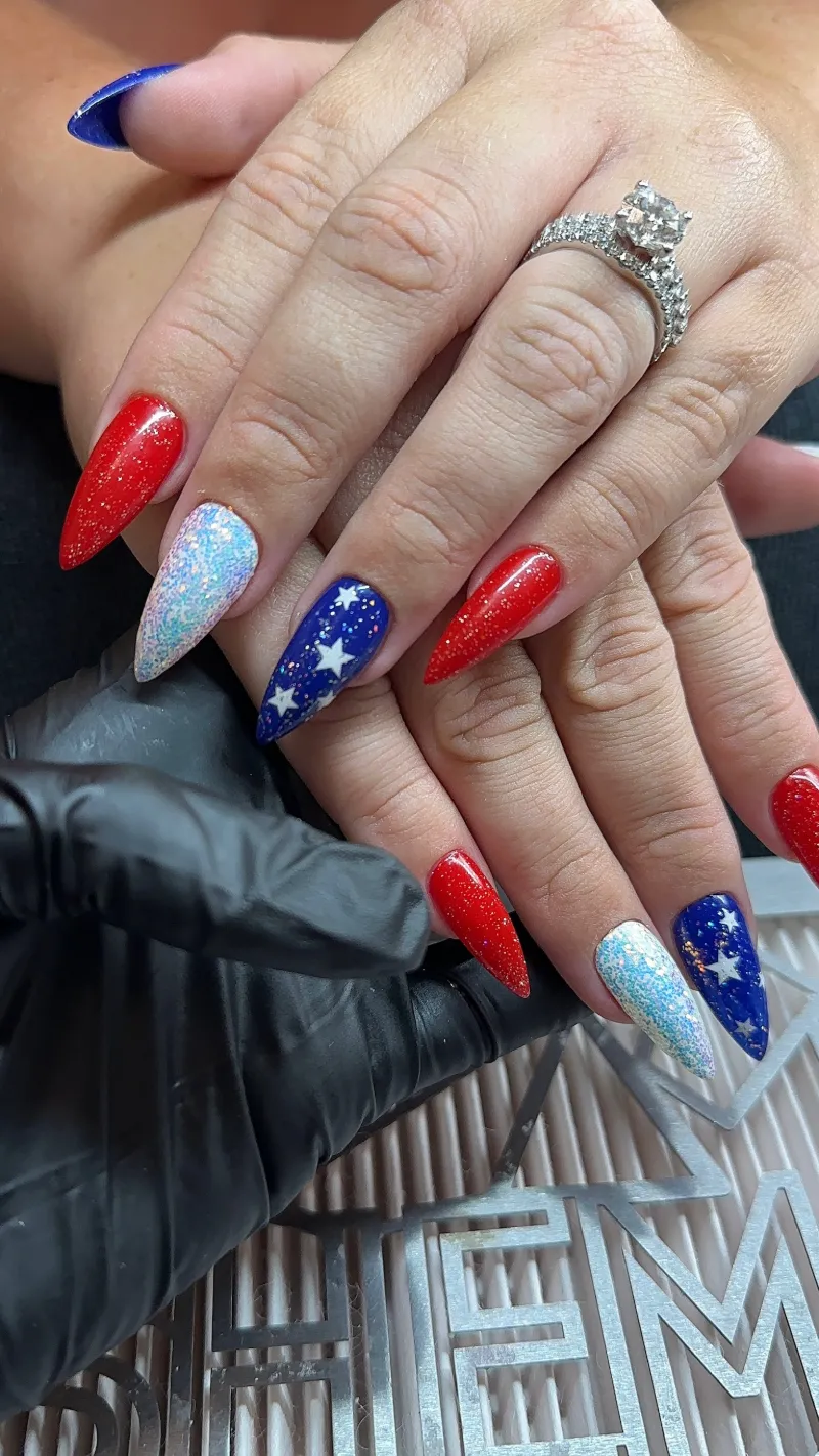 Red, white and blue nails with sparkle and star accents