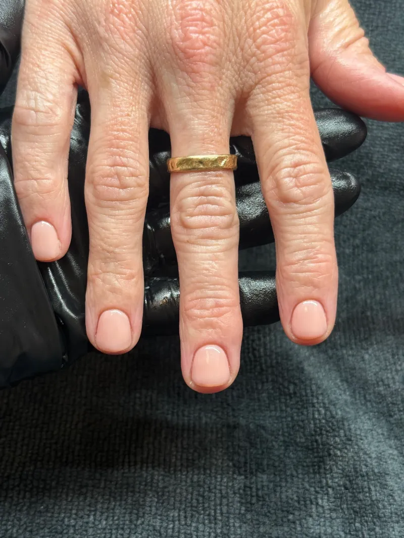 Short rounded nails in a soft peach nude